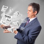 Handsome middle aged businessman holding notebook and reading th