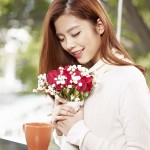 Young Woman With Flowers