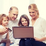 family, children, technology, money and home concept – smiling f